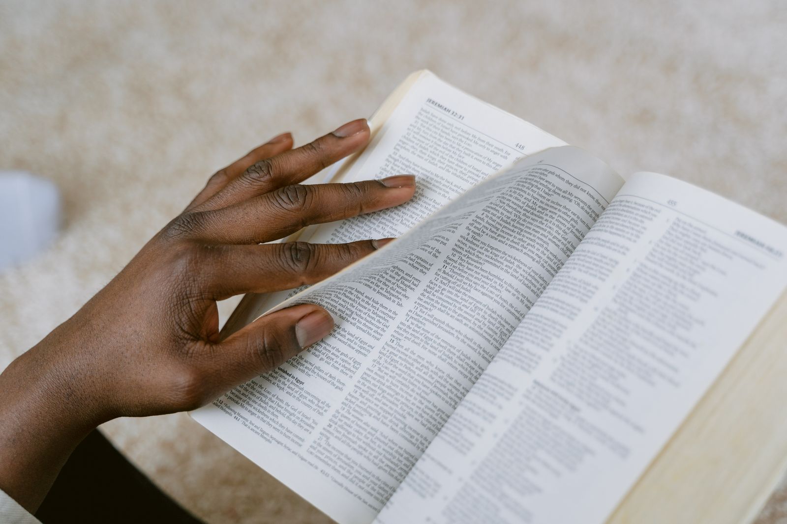 A person reading an open Bible