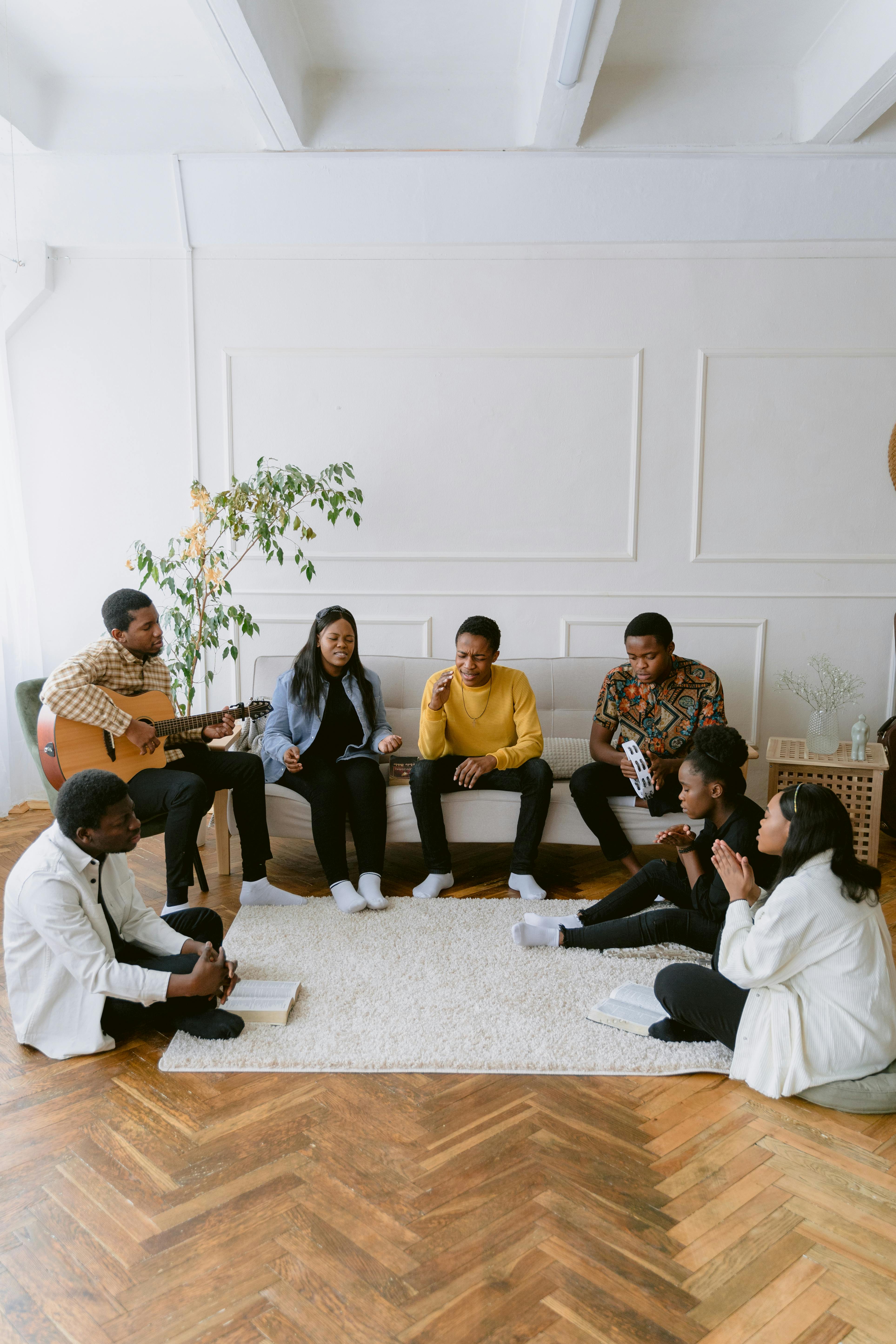 a group of people singing in a room