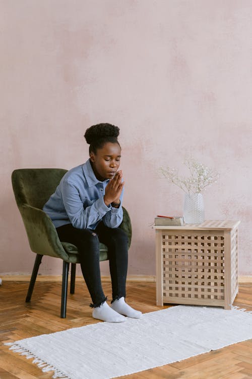 A Woman Sitting and Praying