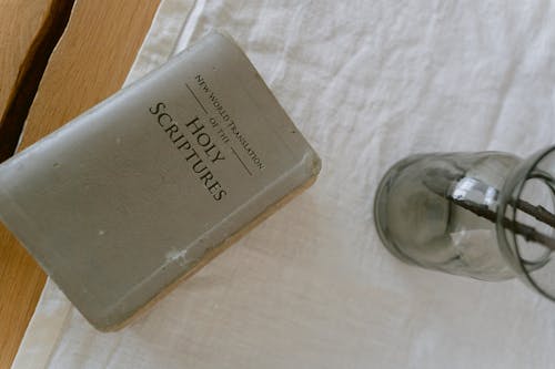 Close-Up Shot of a Bible on a Table