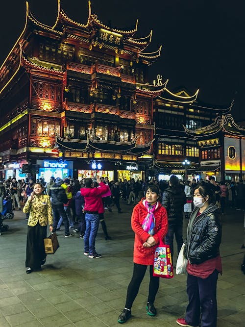 People Walking on Street during Nighttime