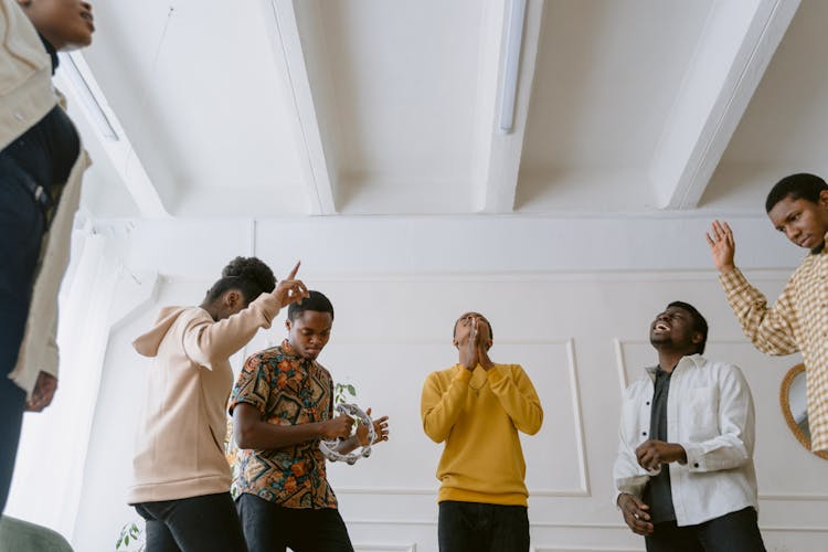 Group Of People Dancing And Singing 