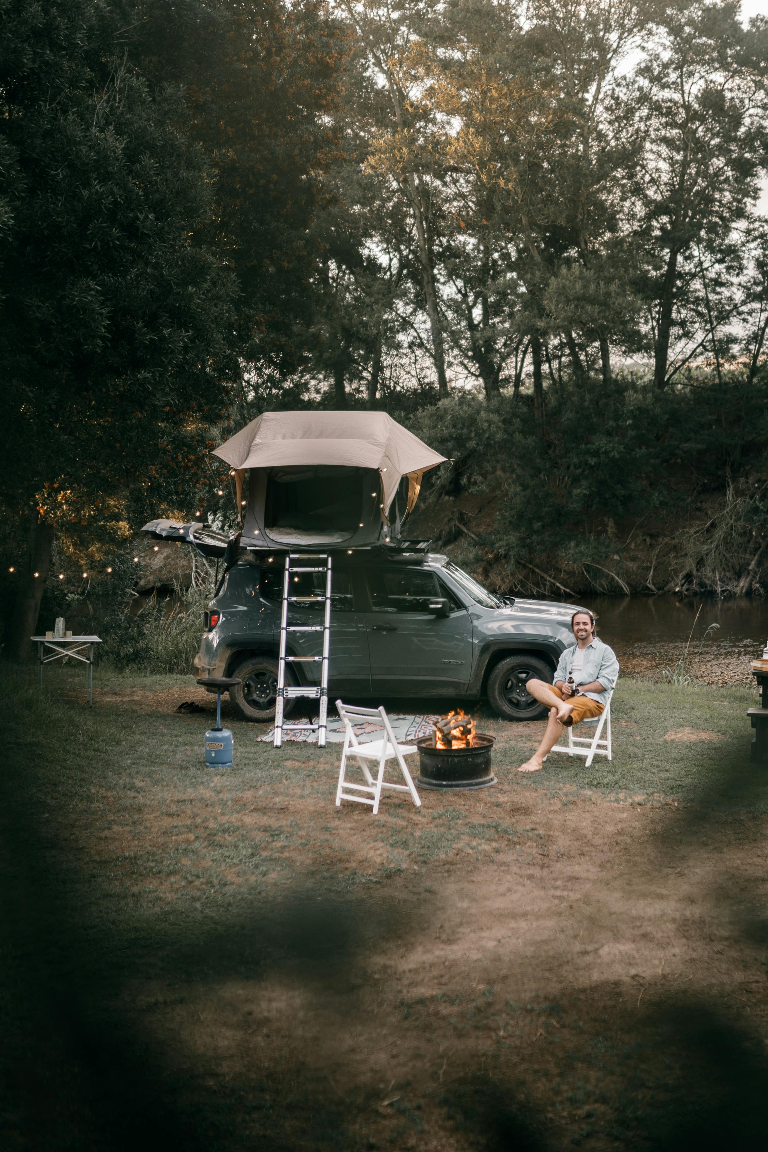 photo of a man camping