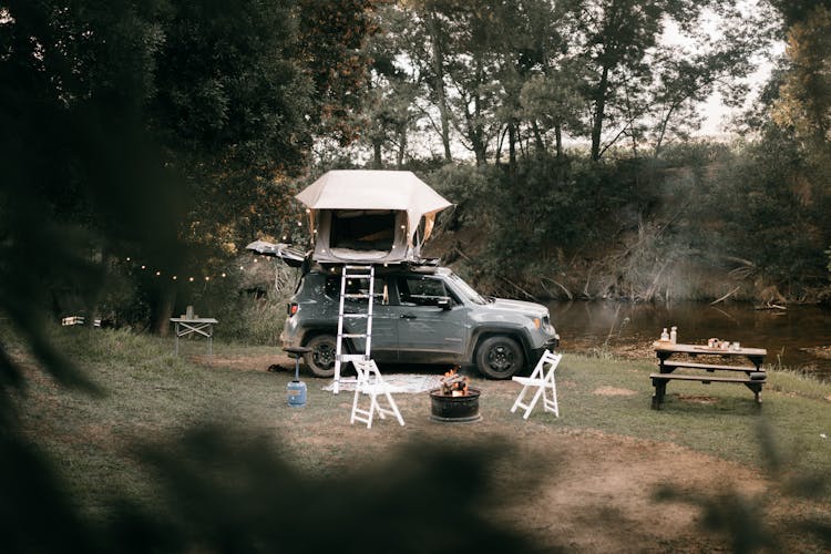 Photograph Of A Car On A Camping Site