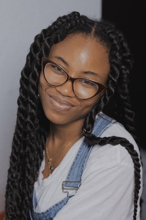 A Woman Wearing a Pair of Eyeglasses with Braided Hair