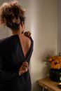 Woman in Black Spaghetti Strap Top Holding Her Hair