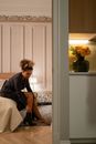 Woman in Black Shirt Sitting on Chair