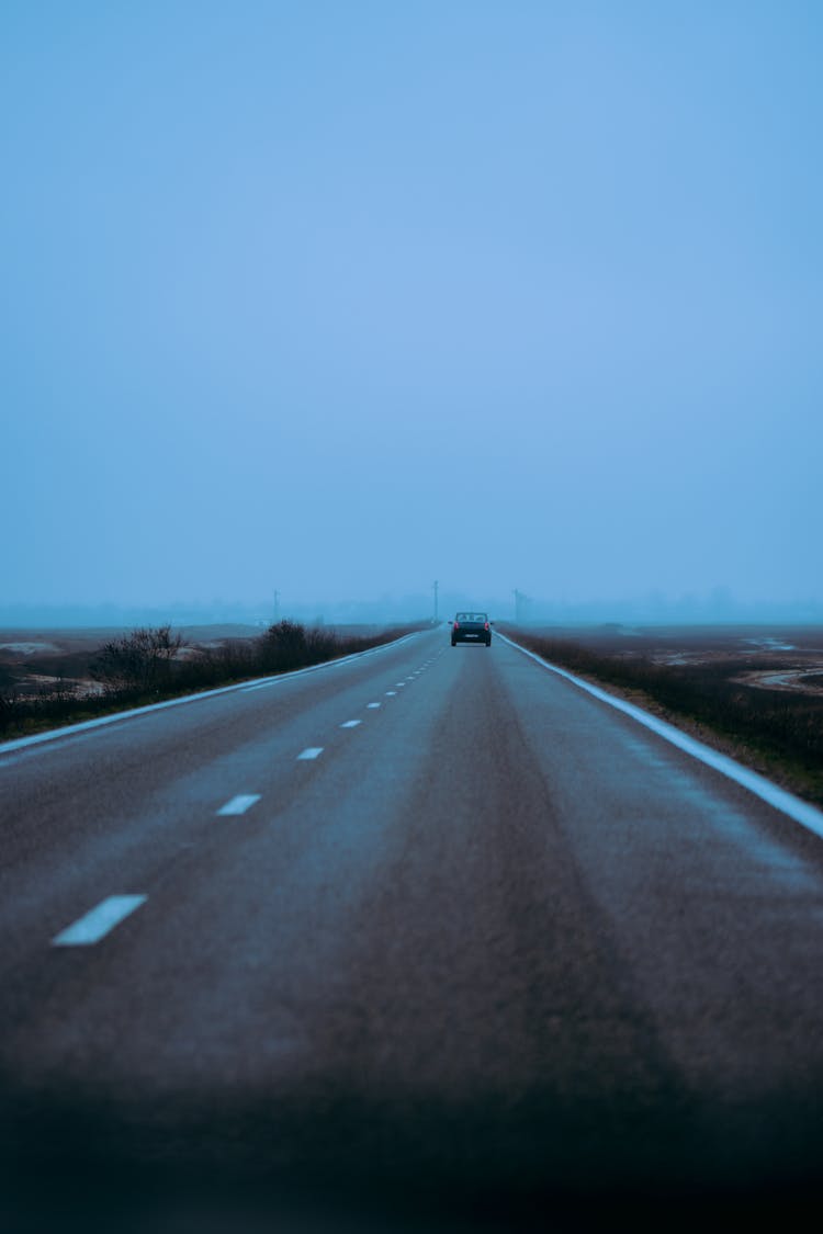 Car Driving On Straight Road In Countryside