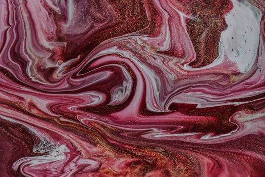 Top view of abstract backdrop representing mixed paints creating thin curves on colorful surface