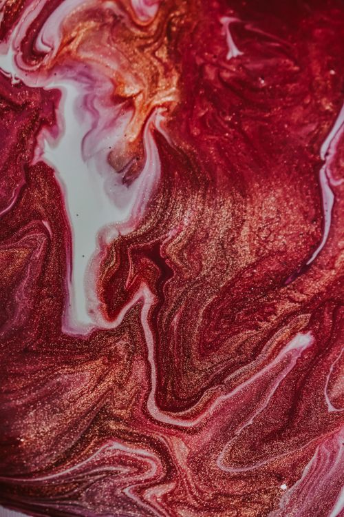 Free Overhead view of abstract backdrop representing colorful painting with curved brown and white dye fluids Stock Photo