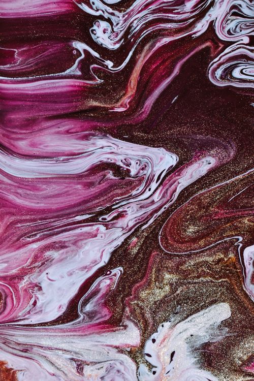 Free Top view of background representing wavy multicolored dye fluids with small blots and dynamic swirls Stock Photo