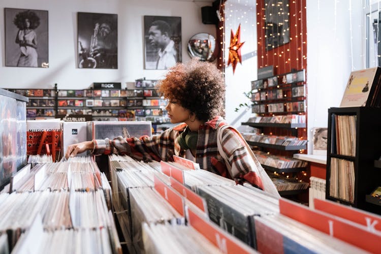 A Woman Looking At Vinyl Records