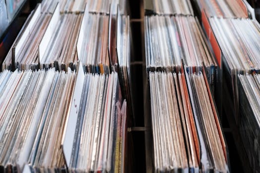 Close-up view of vintage vinyl records in a store setting, showcasing a retro music collection.