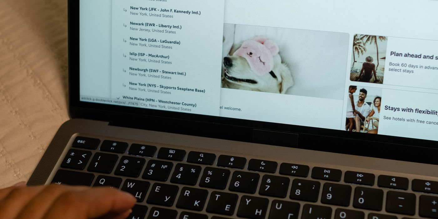 A traveler comparing hotel prices on a laptop as Google changes how hotel rates appear in search