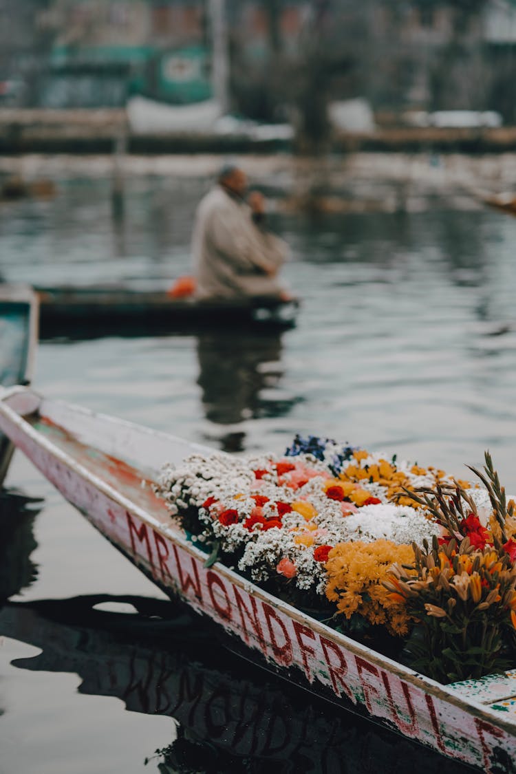 Docked Boat With Bed Of Flowers