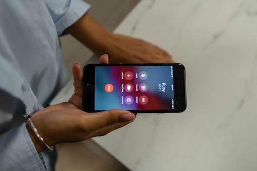 Close-Up Shot of a Person Calling on a Phone