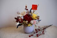 Assorted Flowers in Gray Ceramic Vase with a Note
