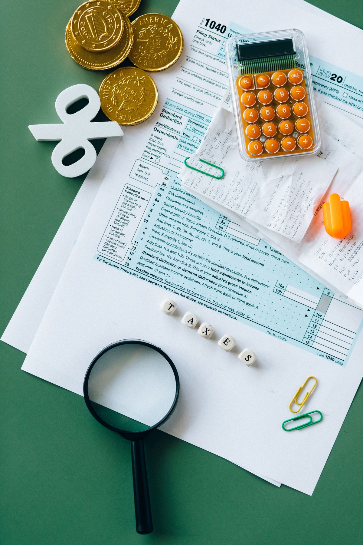 Tax forms and calculator on a desk during personal tax preparation in Dallas