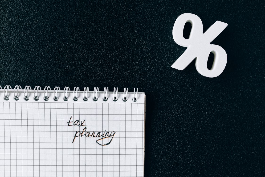 Tax planning documents and a pen — rental property tax obligations Vietnam
