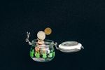 Coins collecting in a glass jar — photo by Nataliya Vaitkevich on Pexels