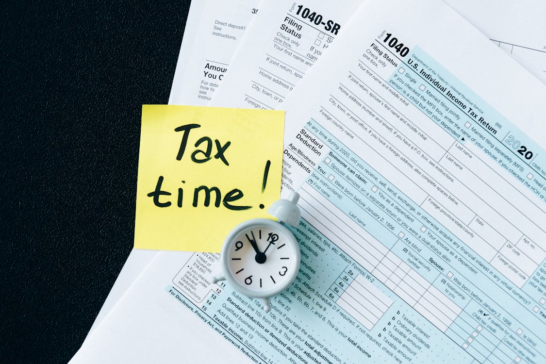 Free Tax Documents on Black Table Stock Photo