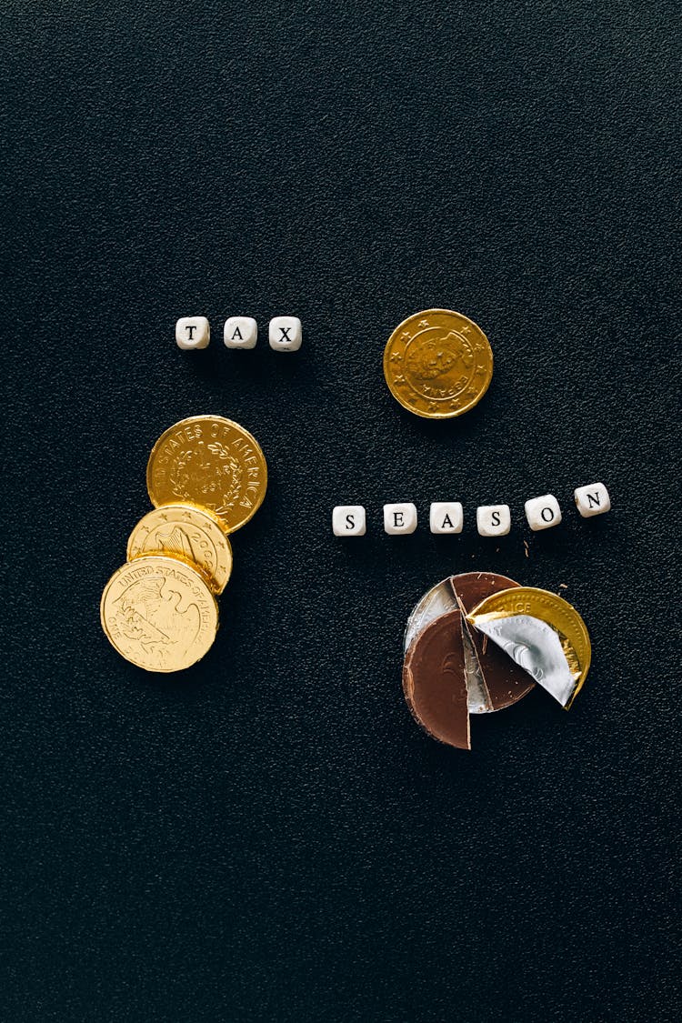 Round Gold Chocolate Coins On Black Surface