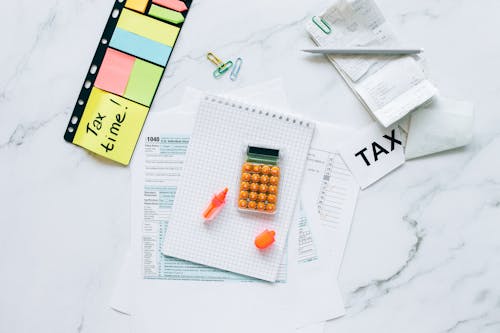 Free Tax Documents on Marble Table Stock Photo
