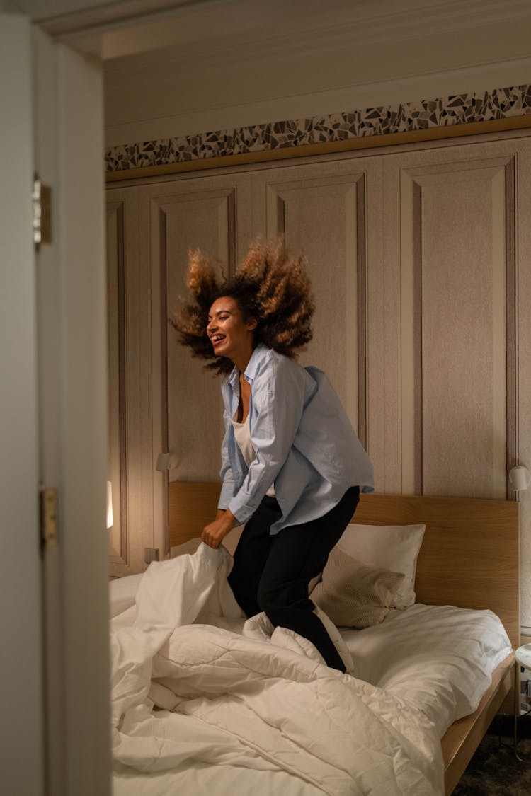 
A Woman Jumping On The Bed