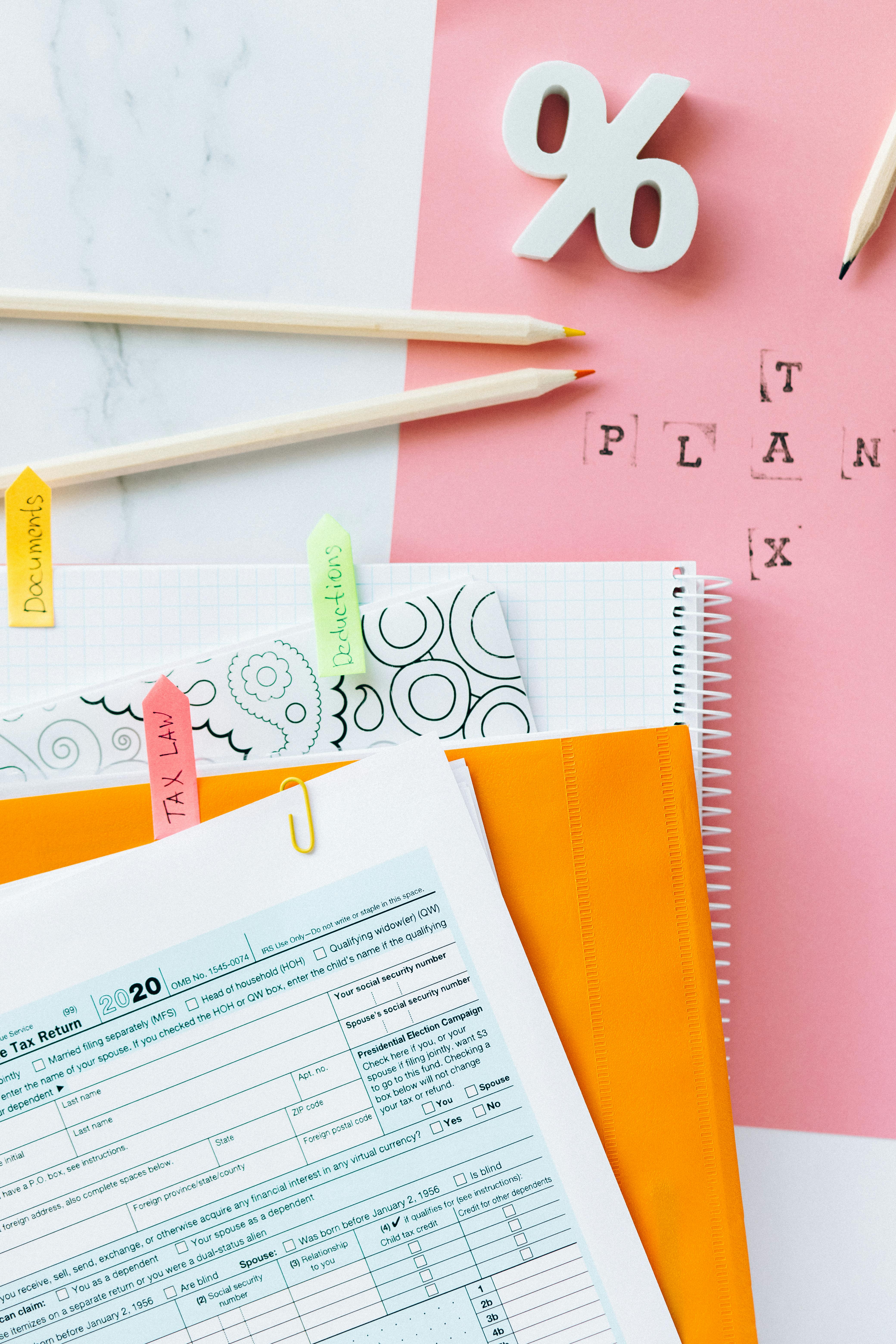 tax return form and notebooks on the table