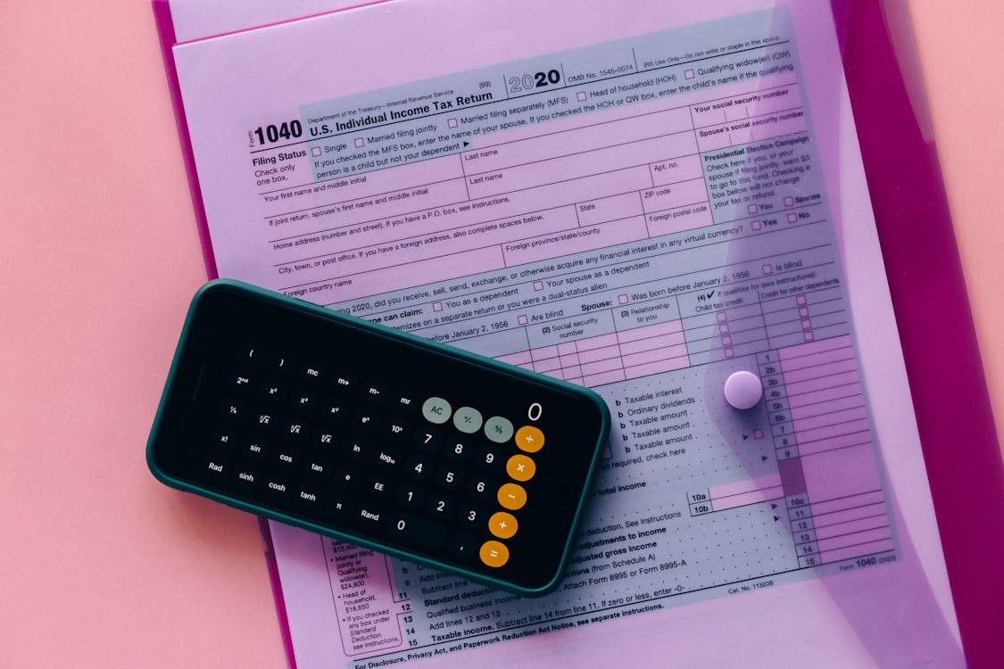 Free Calculator and Tax Forms Inside the Clear Envelope Stock Photo
