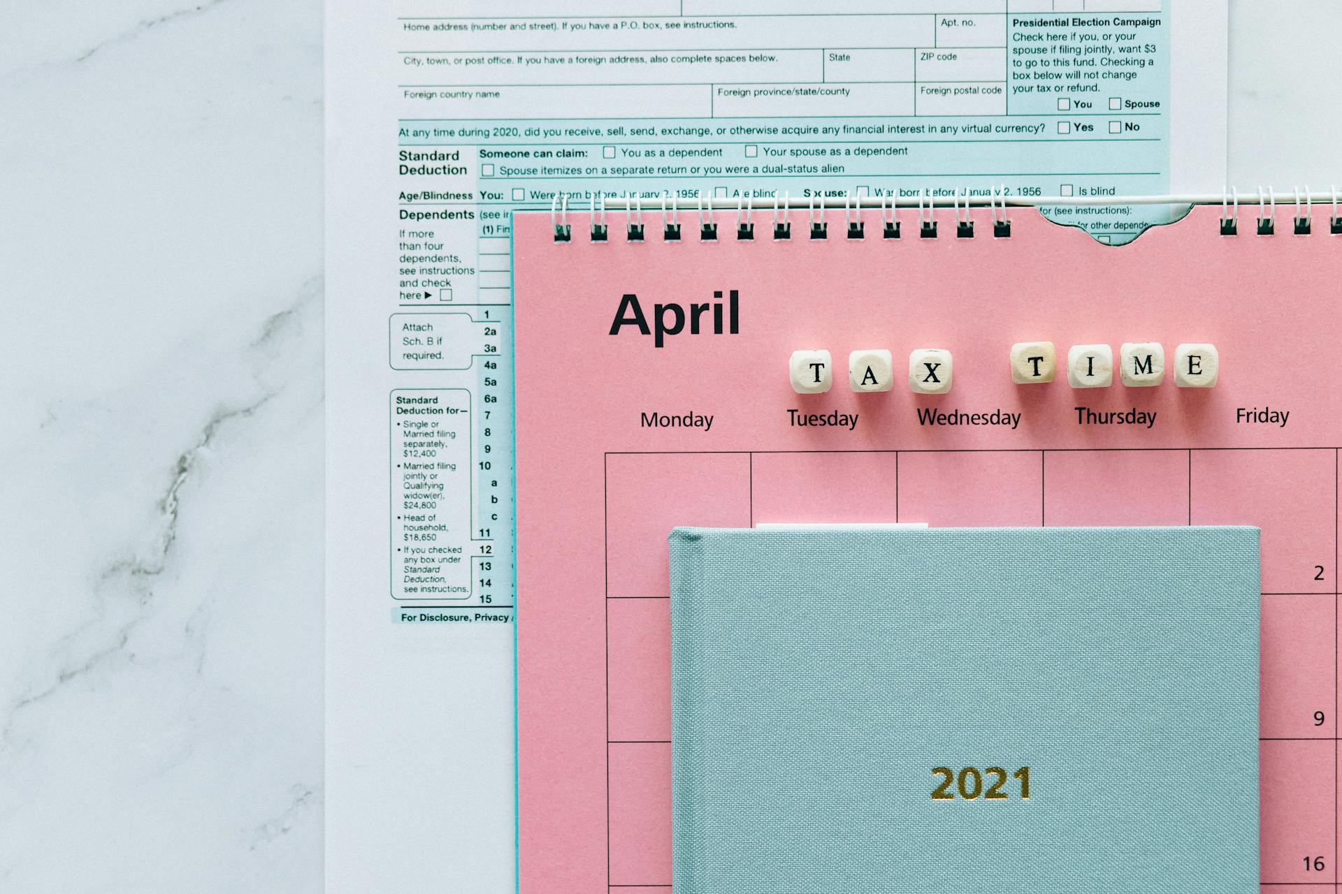 Tax Return Form and 2021 Planner on the Table