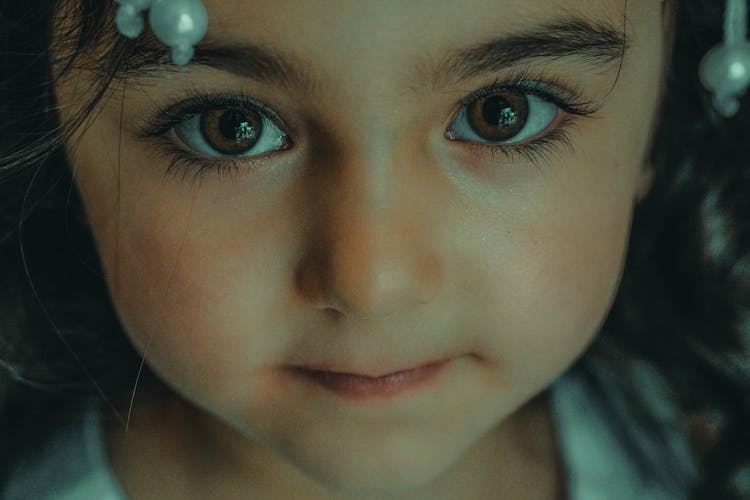 Portrait Of A Child With Brown Eyes