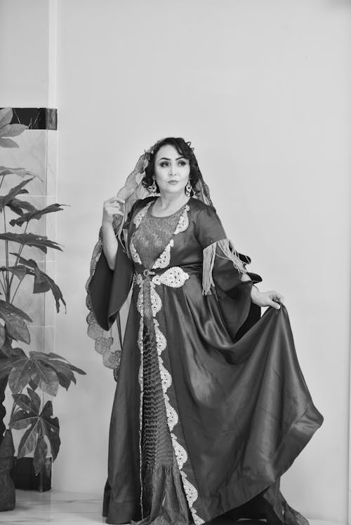 Grayscale Photo of Woman in Islamic Kaftan Dress