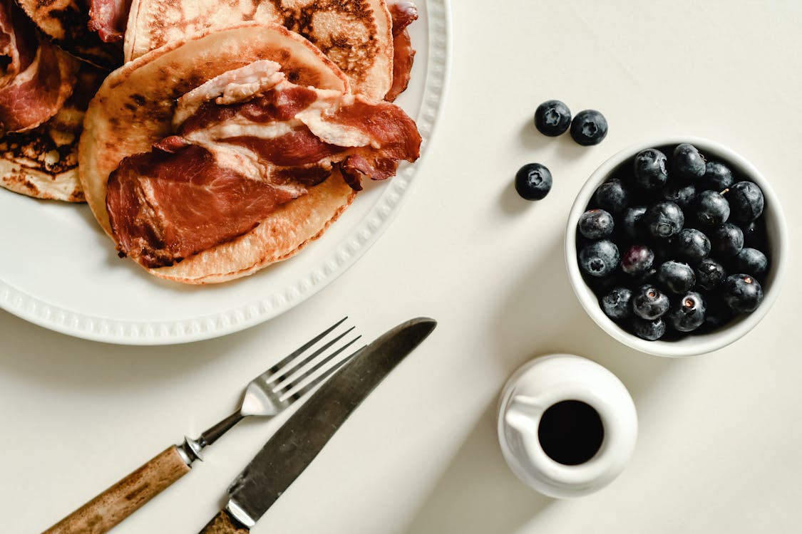 Free A Plate of Pancakes and a Cup of Blueberries Stock Photo