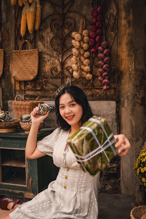 Portrait of Smiling Woman Offering Present