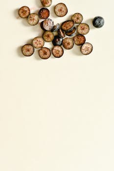 Sliced blueberries arranged on a white background, showcasing minimalist food photography.