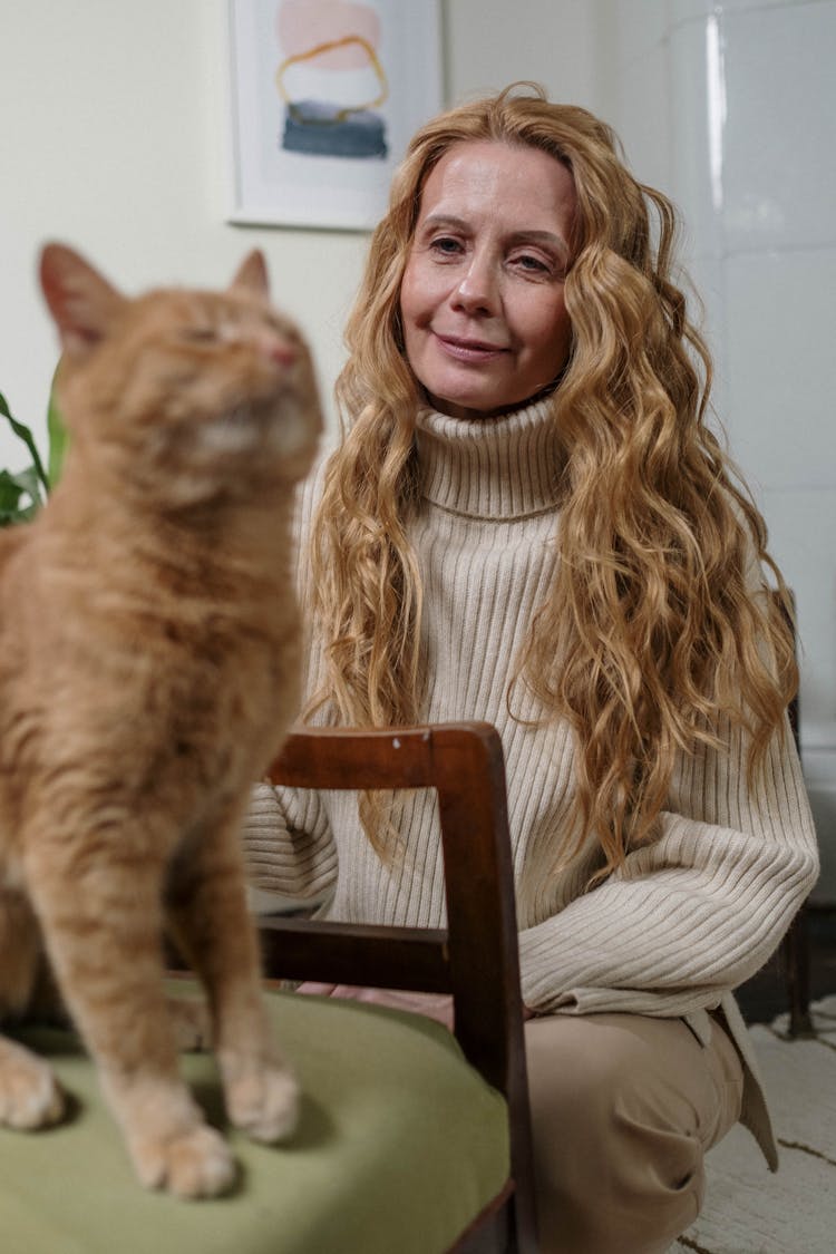 Woman With Her Orange Cat