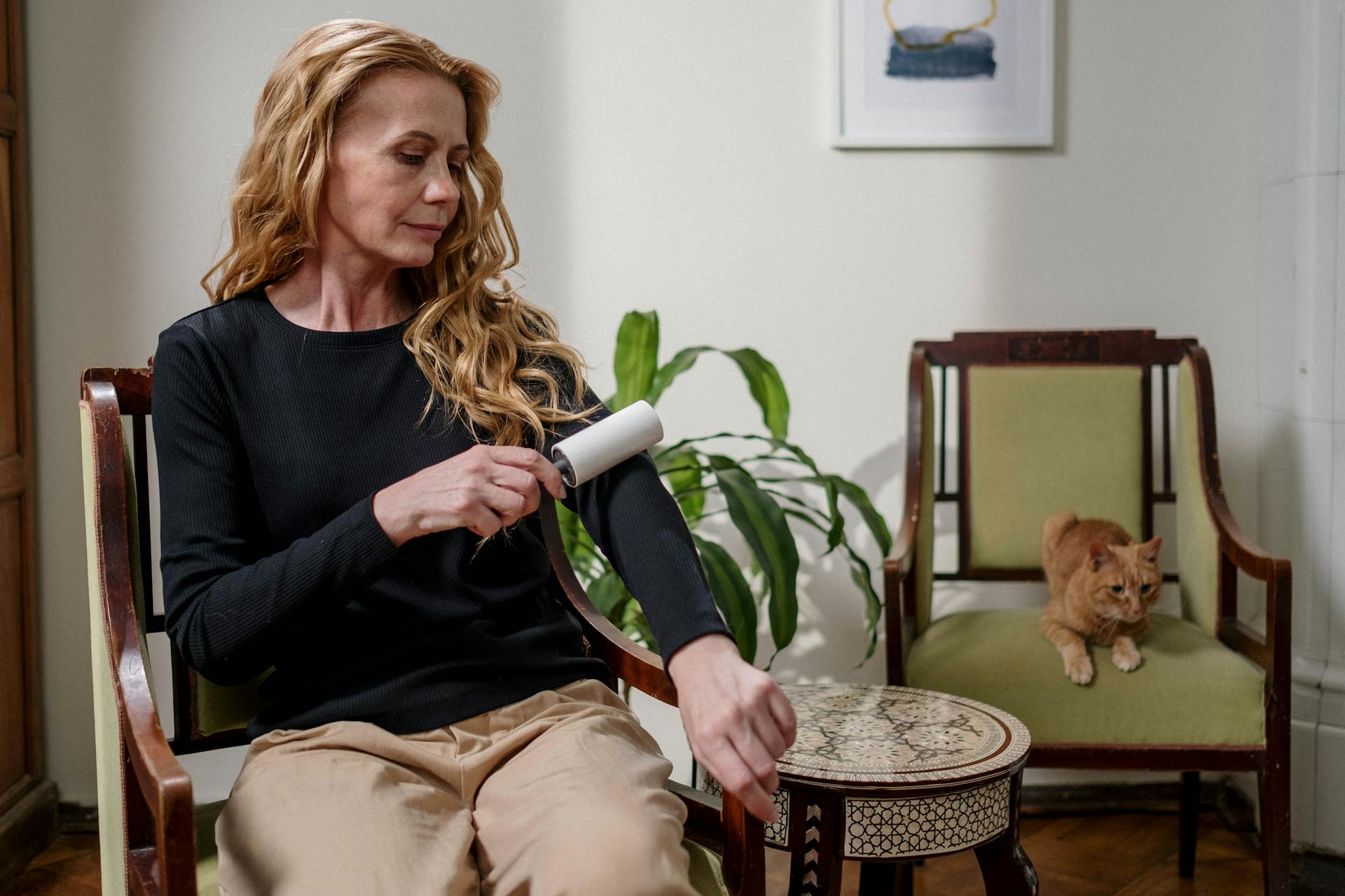 Woman Using Lint Remover