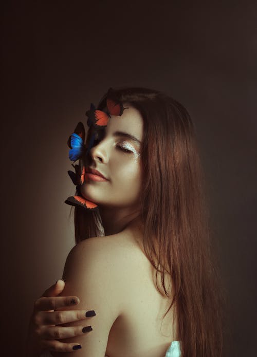 A Woman with Butterflies on Her Face