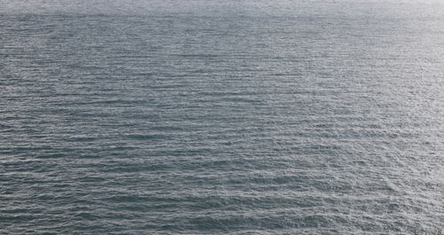 Free Captivating aerial photograph showcasing the serene and expansive ocean surface. Stock Photo