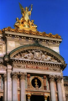 Close-up of the intricate facade of Palais Garnier, showcasing sculptures and architectural details in Paris.
