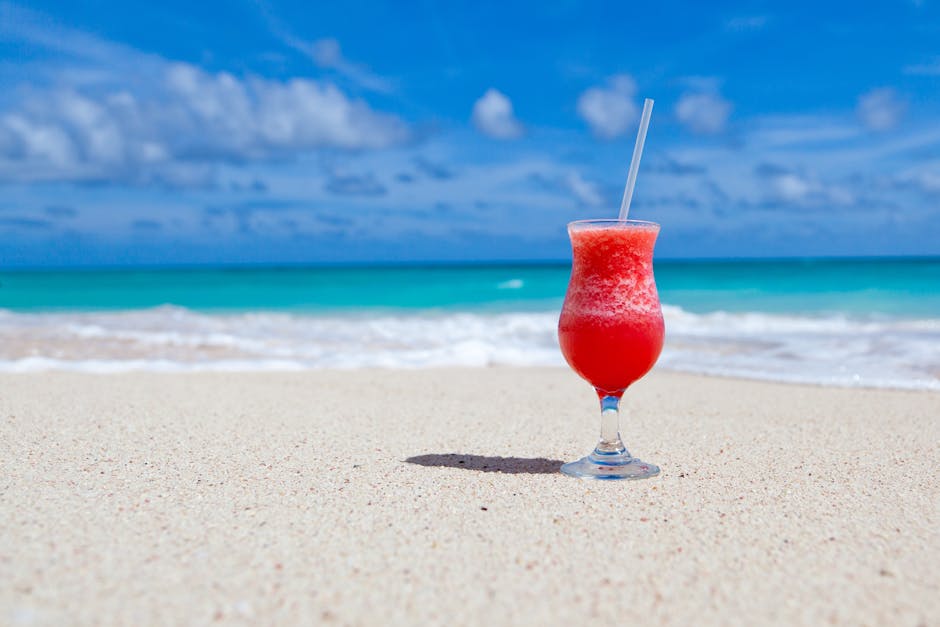 Red Slush Drink in Glass on Beach