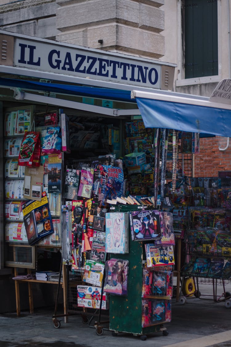 Assorted Magazines On Blue Steel Rack