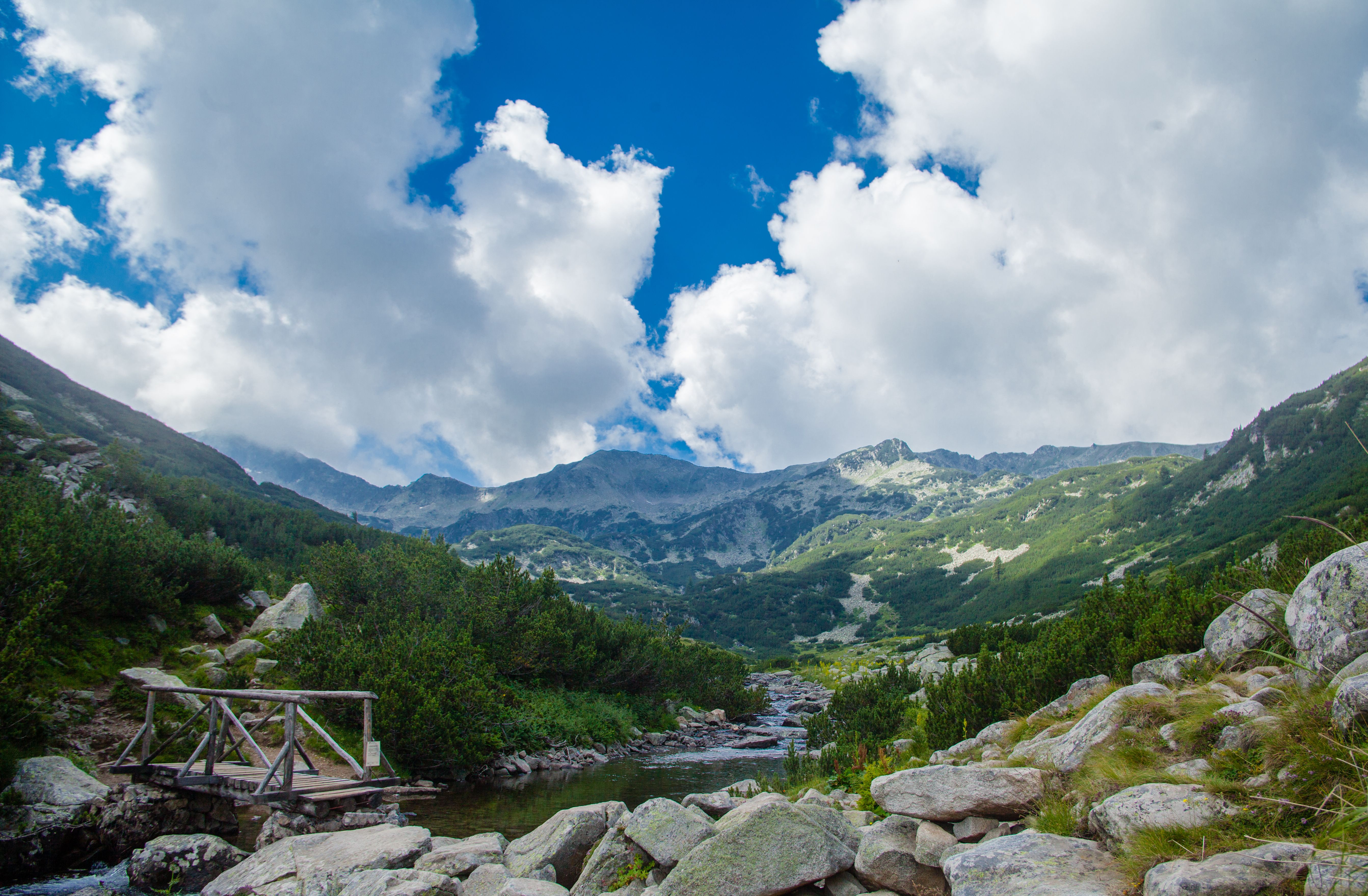 Sturdy hiking boots and a backpack ready for a trek in the Rila Mountains, Bulgaria.
