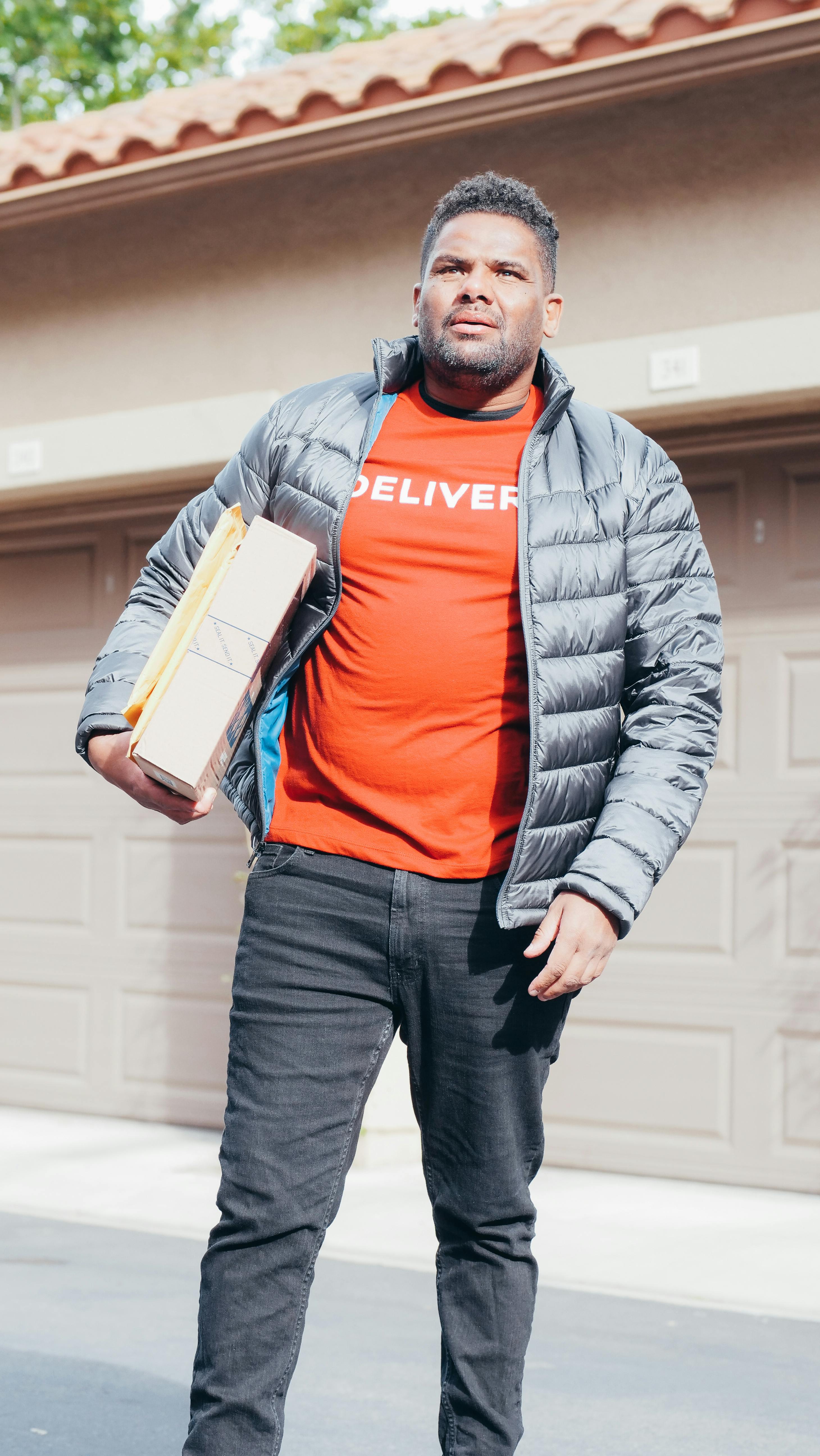 Man in Orange Shirt Riding on a Motorbike Making a Delivery · Free ...