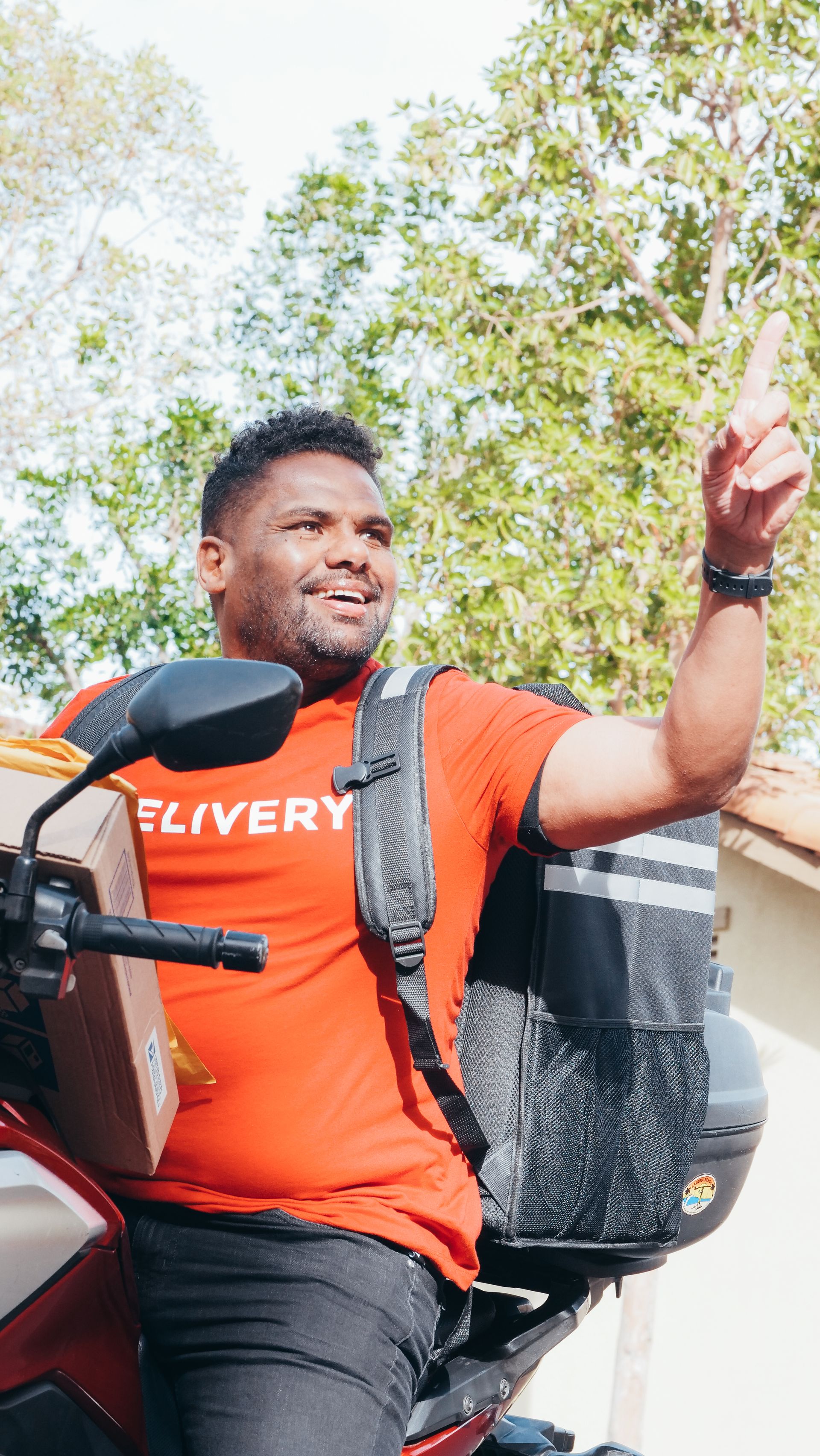 Food delivery rider on motorbike in urban setting — gig economy worker rights frame for al