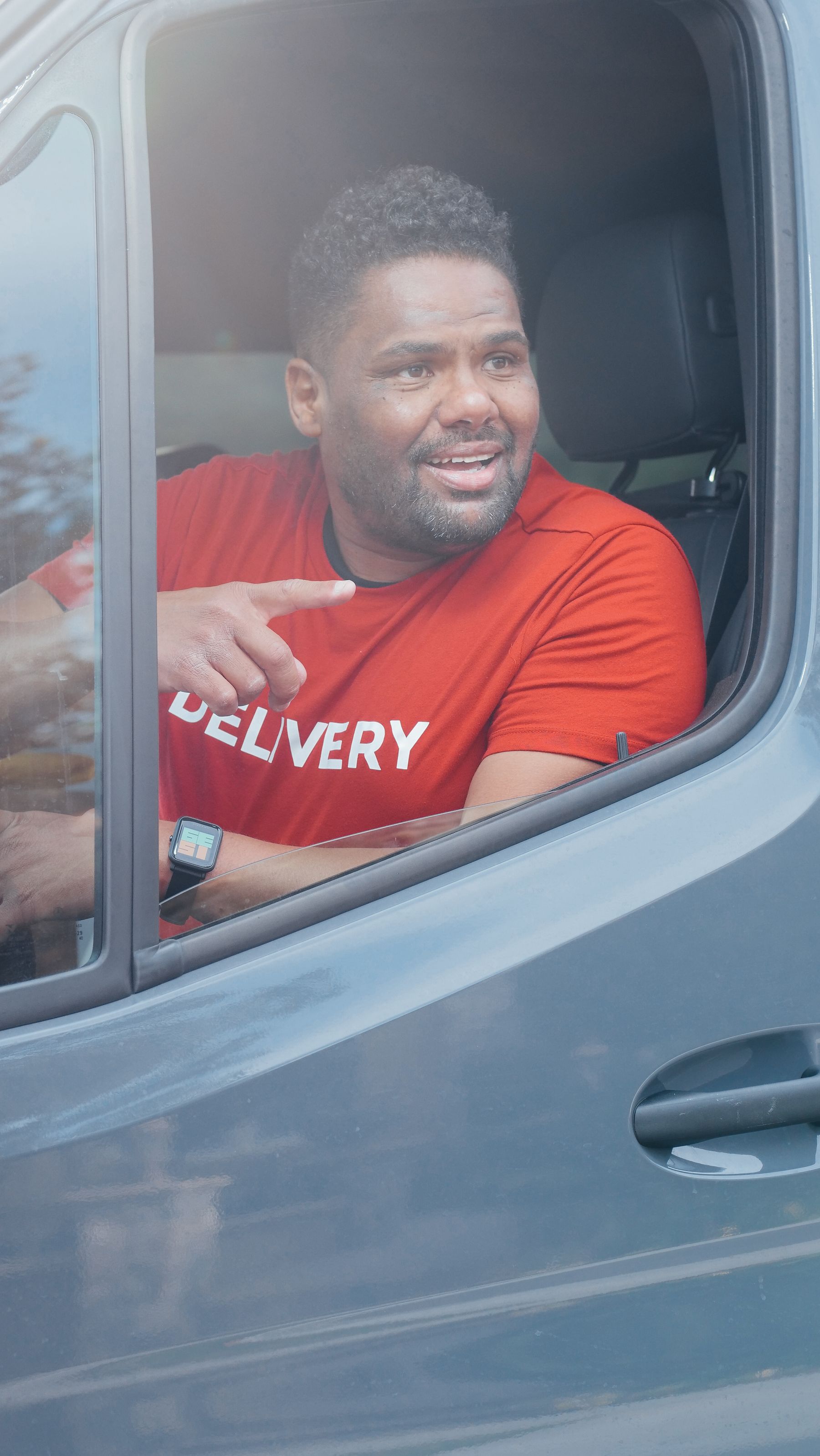 Delivery professional carrying packages for the daily route