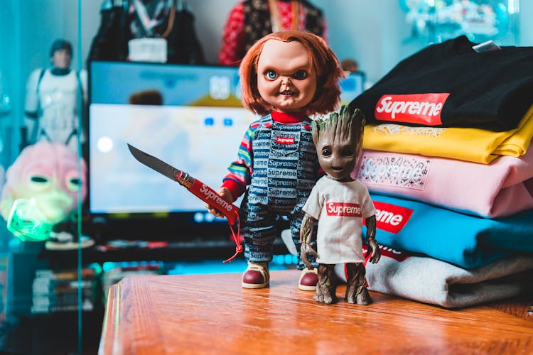 Chucky Doll And Groot Dressed In Supreme Clothing 