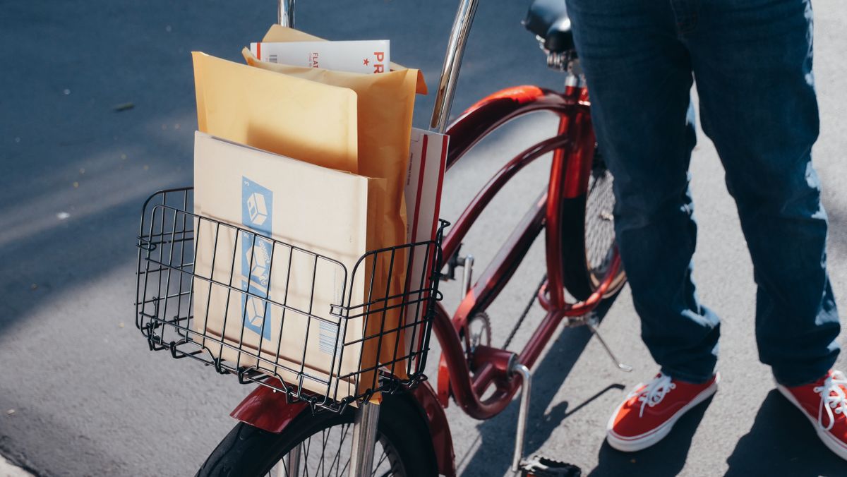 Bicycle with parcels arranged in a front cargo basket for delivery