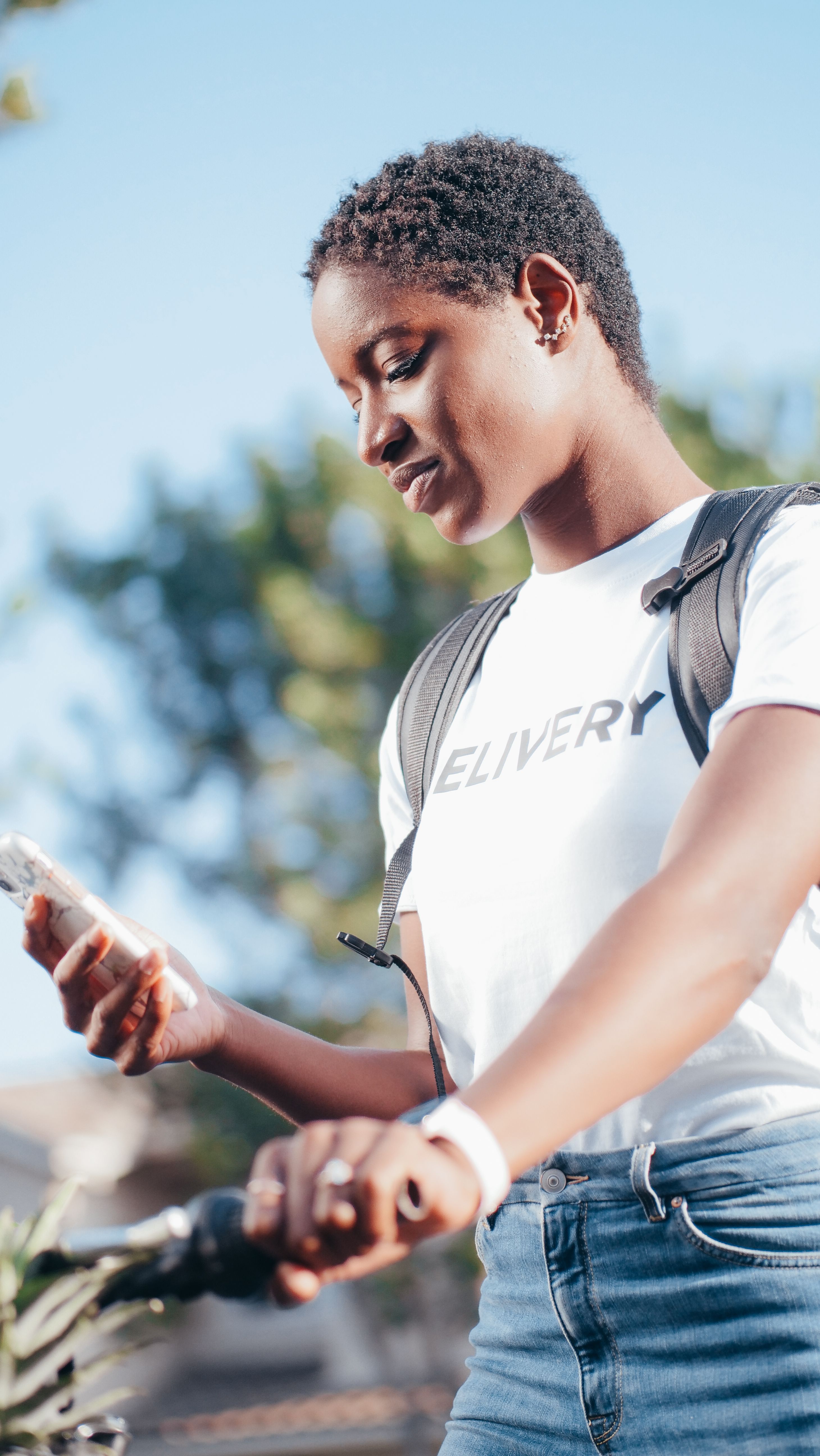 A woman using an app on her smartphone